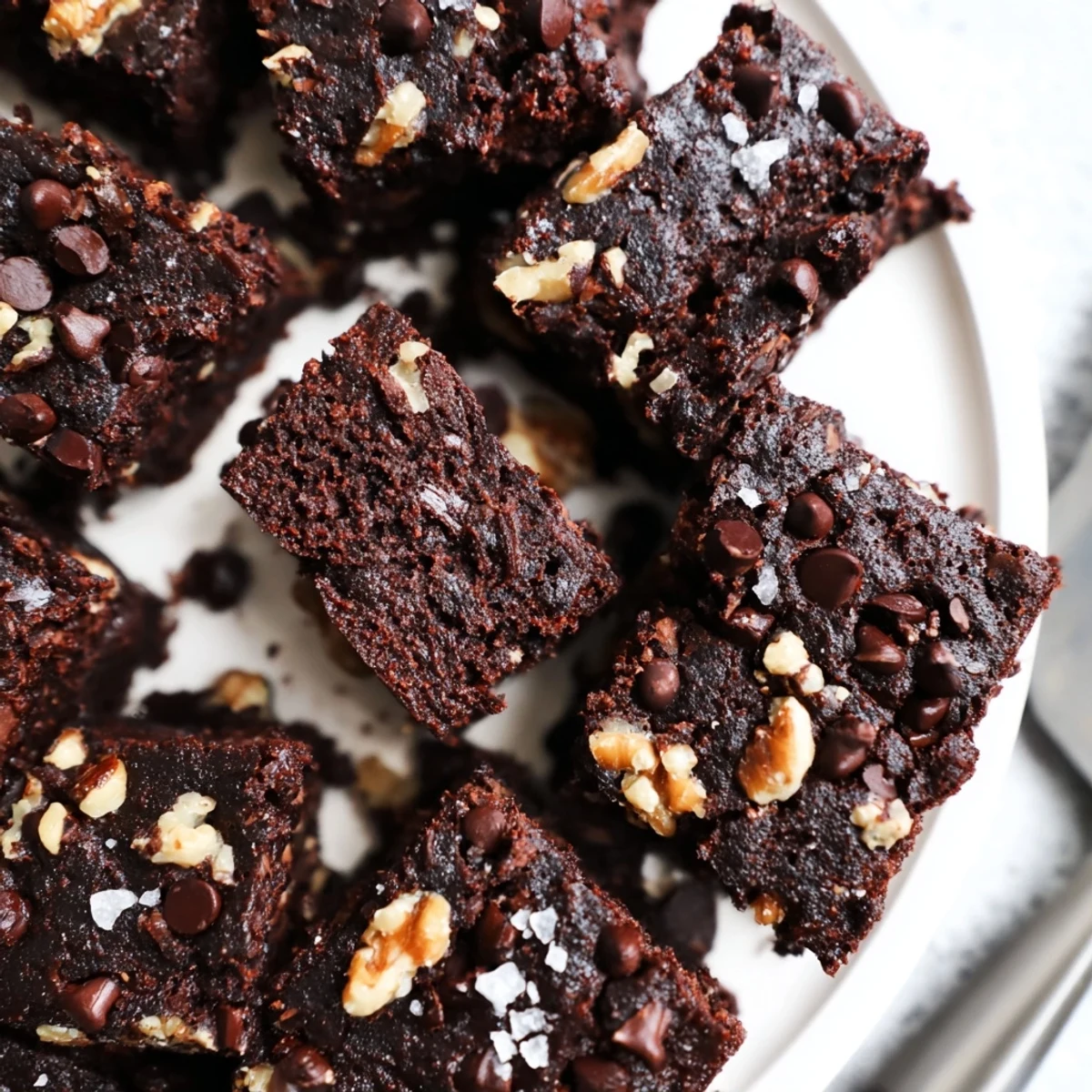 Decadent zero-waste brownies using nut-milk pulp, topped with chocolate chips.  