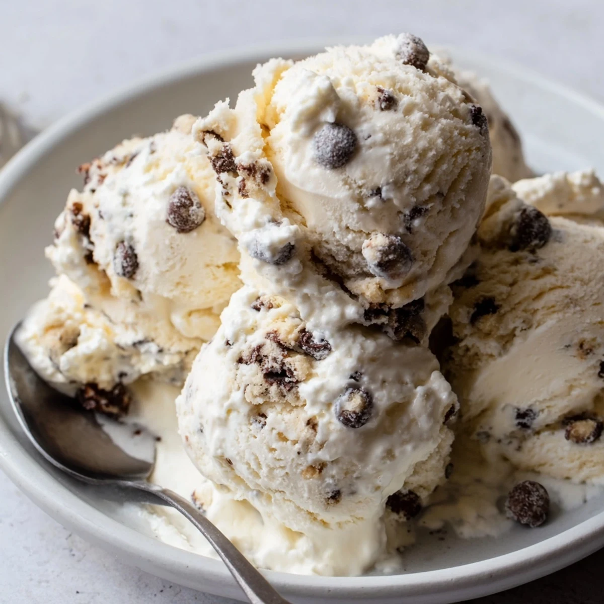 Creamy cottage cheese ice cream with chocolate chip cookie dough bites served in a bowl.  