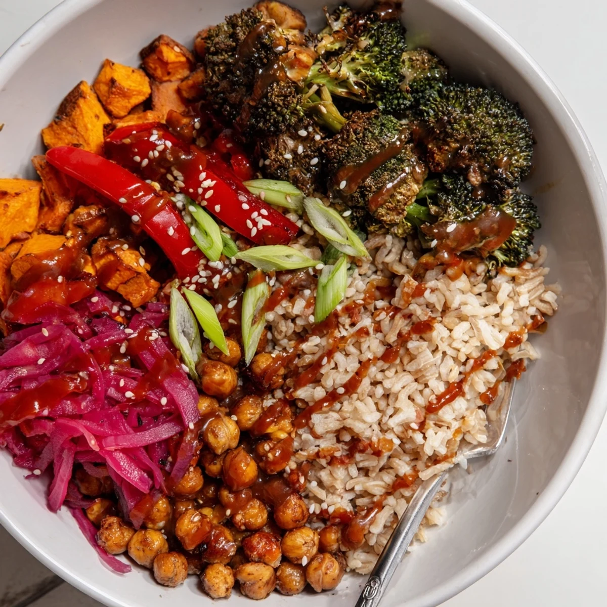 Vibrant Bold Sauce Drizzle Bowls topped with roasted veggies and zesty sauces.  