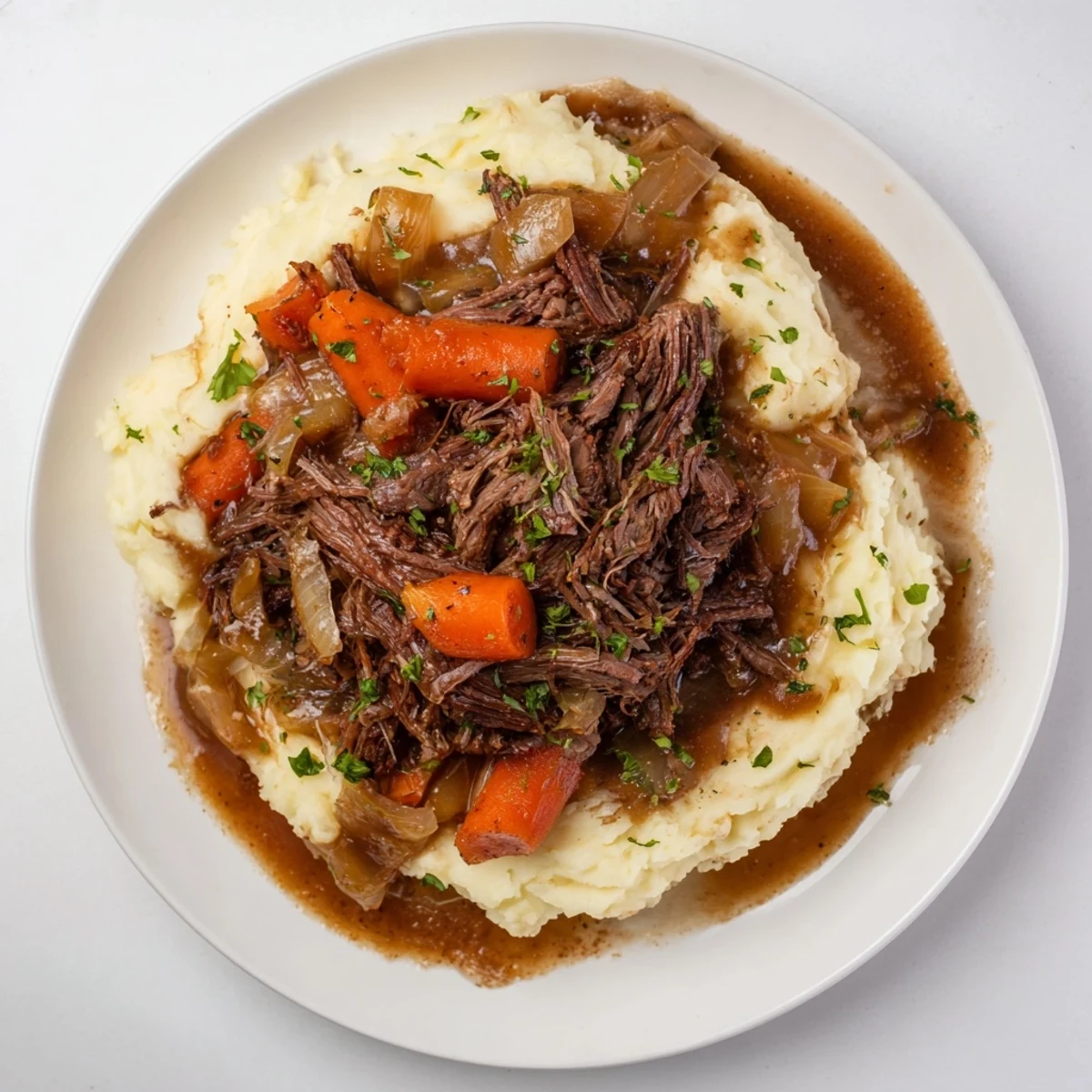 Fork-tender Slow Cooker Pot Roast with vibrant vegetables, swimming in rich gravy, and creamy mashed potatoes.