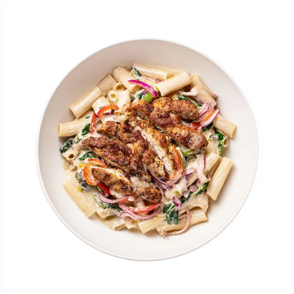 Delicious Creamy Cajun Dirty Snow Chicken Pasta with wilted spinach and a rich, creamy Cajun sauce.