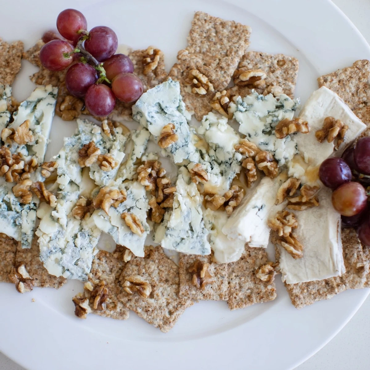 Elegant The Blue Ridge Mountains cheese platter displays blue cheeses, like mountain peaks, with honey-drizzled richness.