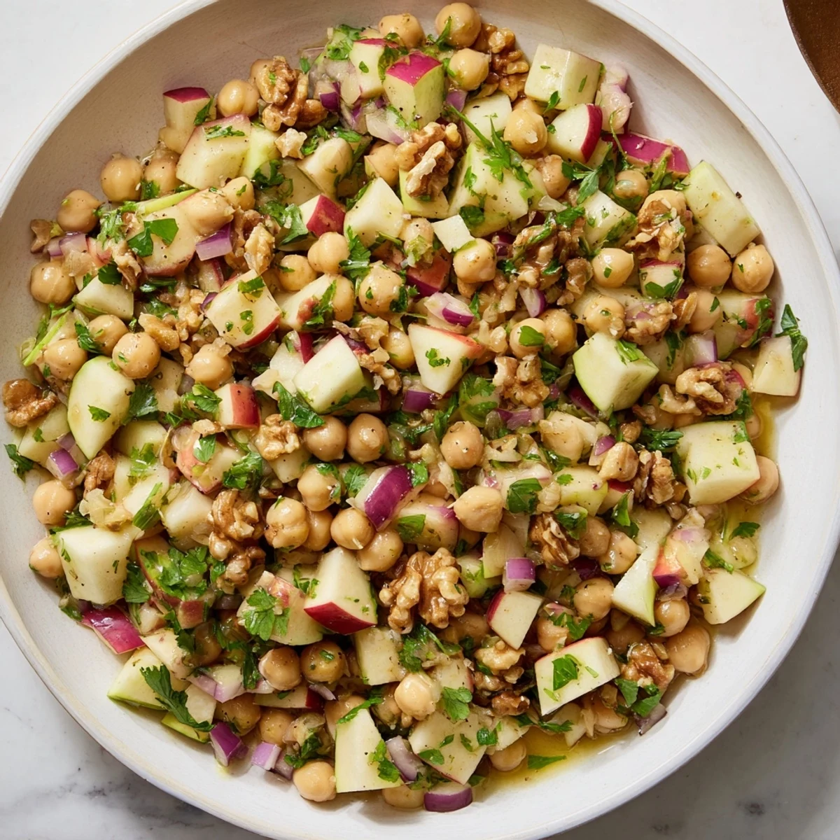 Fall Harvest Apple and Chickpea Salad: A colorful mix of crisp apples and creamy chickpeas, ready to eat.