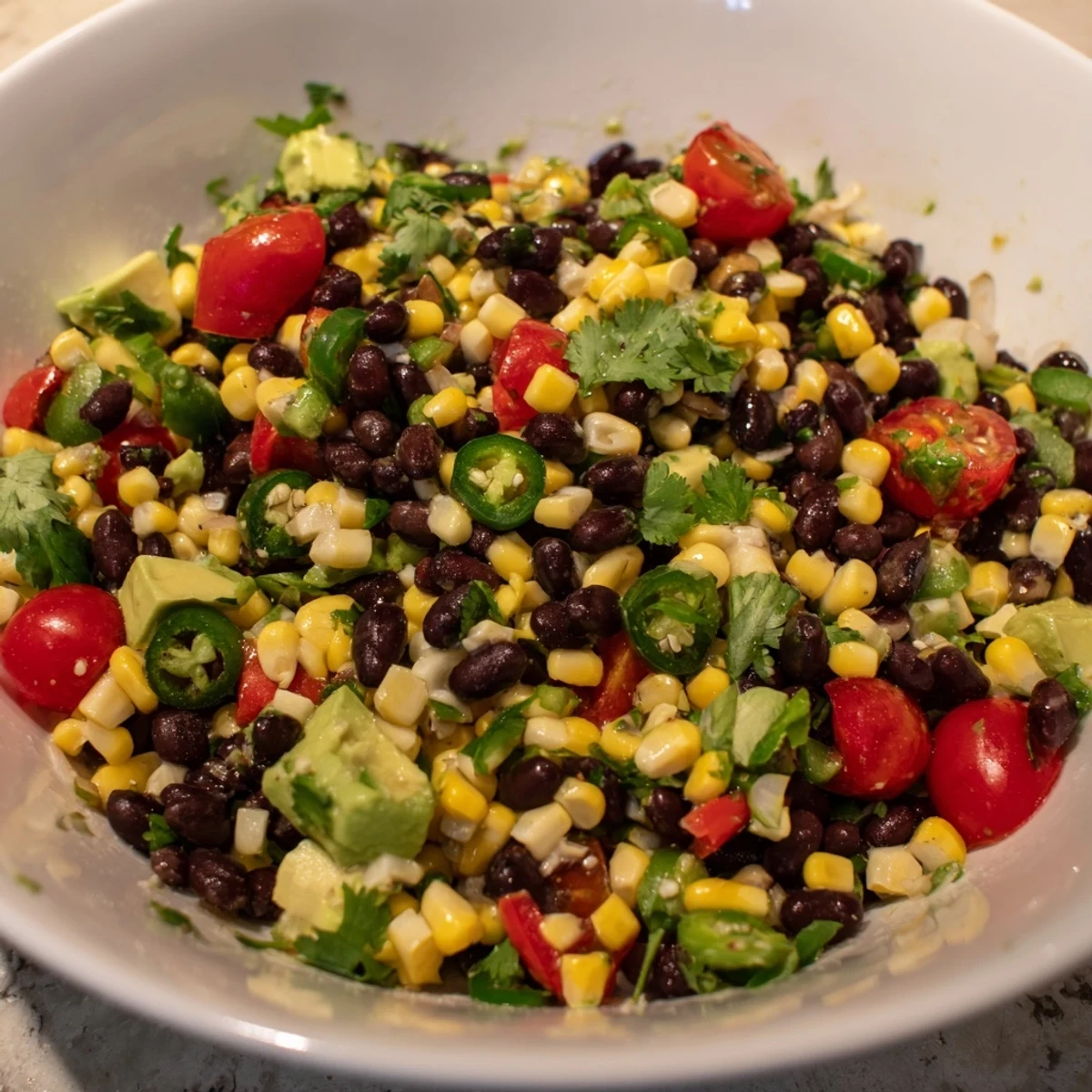 Vibrant Southwestern Black Bean and Corn Salad bursting with fresh corn, red pepper, and cilantro, ready to eat!