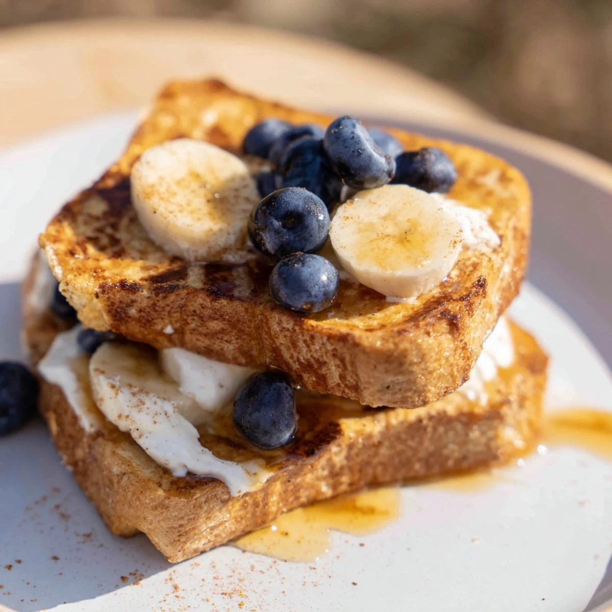 Golden-brown Protein French Toast, topped with fresh berries, promises a delightful, protein-packed breakfast.
