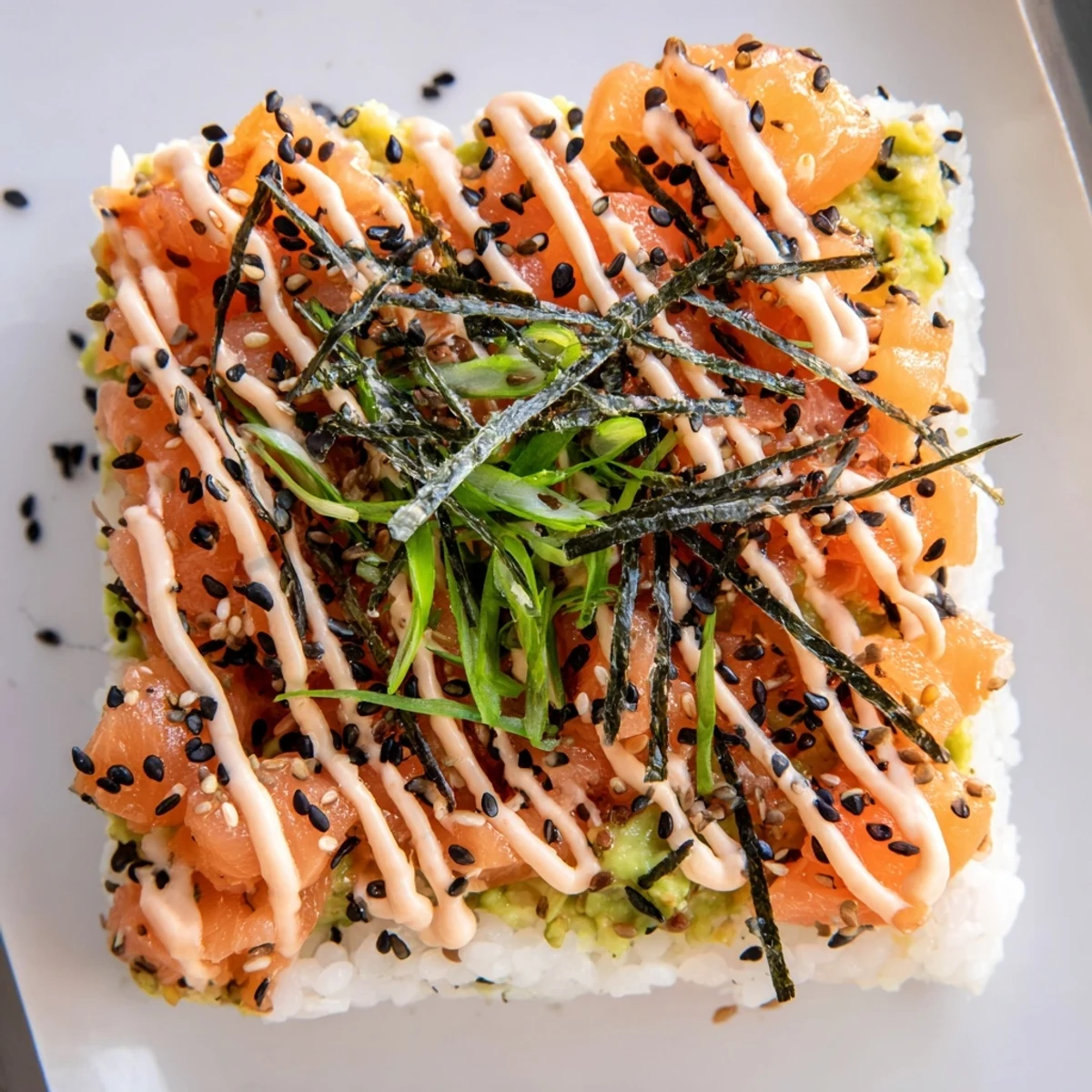 Golden, crispy rice forms layers with salmon and avocado in this Crispy Rice Salmon Stack.