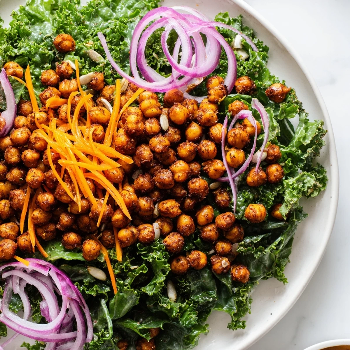 Fresh, crispy Kale Salad with Roasted Chickpeas, with golden chickpeas topping vibrant green kale.