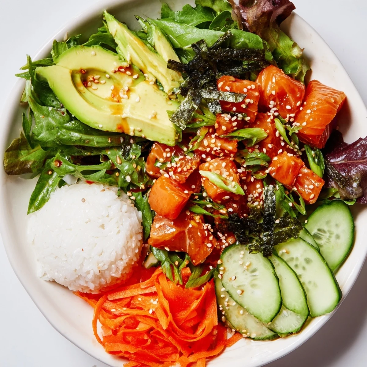 Vibrant poke bowl salad with fresh salmon, cucumbers, avocado, and a tangy soy ginger dressing.
