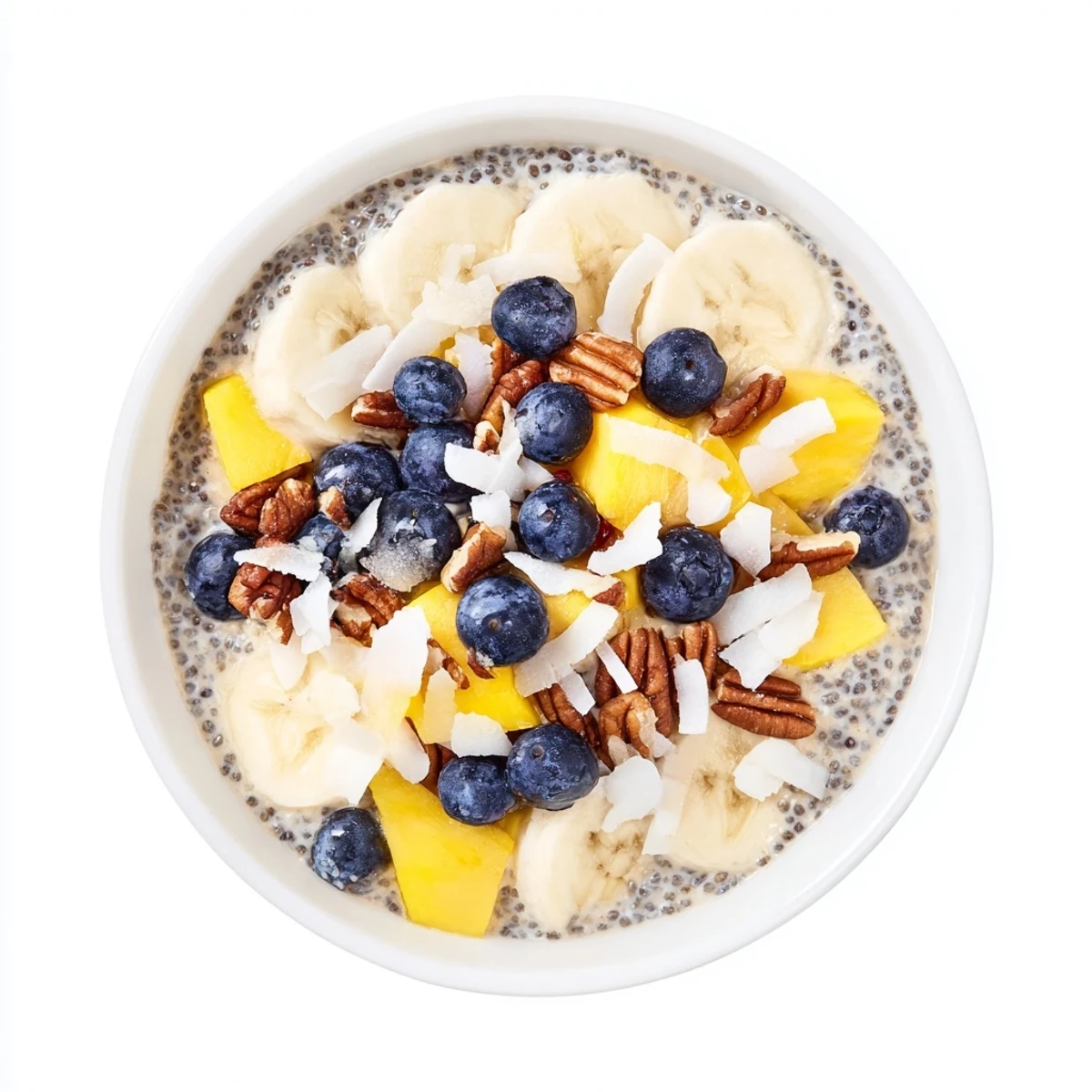 A close-up of chilled chia seed pudding, beautifully topped with colorful fruit and nuts.