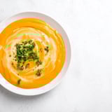 Golden-orange creamy carrot soup, a vegetarian delight, perfect for a cozy weeknight dinner.