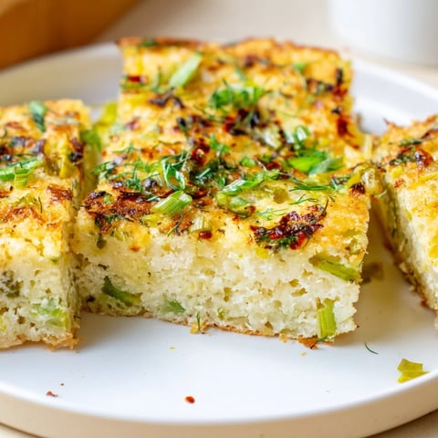 Fluffy Dill Pickle Chili Garlic Monster Cake Pancake Bars garnished with fresh dill.  