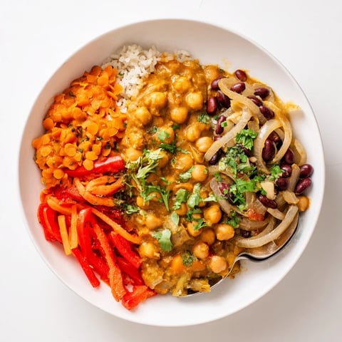Vibrant Single-Pan Indian Chickpea Curry with coconut milk and fresh cilantro garnish.  