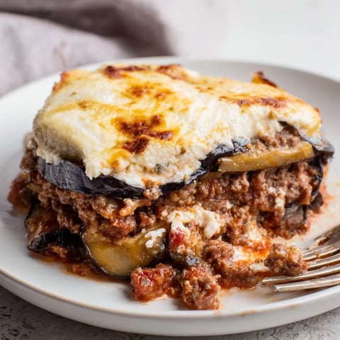 Delicious moussaka with beef and eggplant, topped with creamy béchamel sauce.  