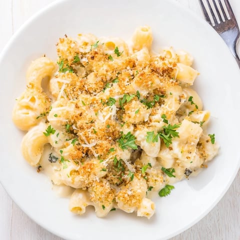 Decadent Truffle Macaroni & Cheese topped with golden-brown panko breadcrumbs, bubbling delightfully.  