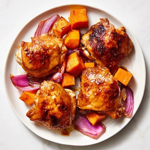 Golden-brown Maple Glazed Chicken & Sweet Potato Bake with tender sweet potatoes and crispy chicken.
