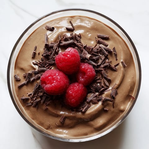 Smooth, decadent avocado chocolate pudding, swirled with optional coconut whipped cream for dessert.