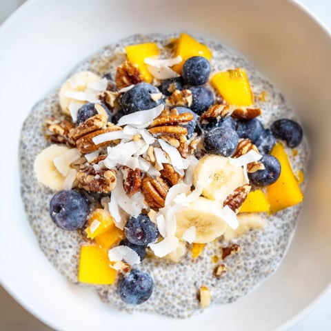 Creamy chia seed pudding, swirled with fresh berries, ready for a healthy breakfast.