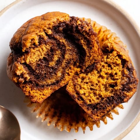 Aromatic gingerbread pumpkin muffin swirls, perfect for cozy autumn breakfast gatherings.  