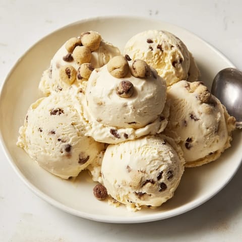 Guilt-free cottage cheese ice cream topped with chewy cookie dough for a sweet treat.  
