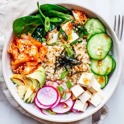 Colorful Fermented Vegetable Bowl with quinoa, fresh radishes, and a savory dressing.  