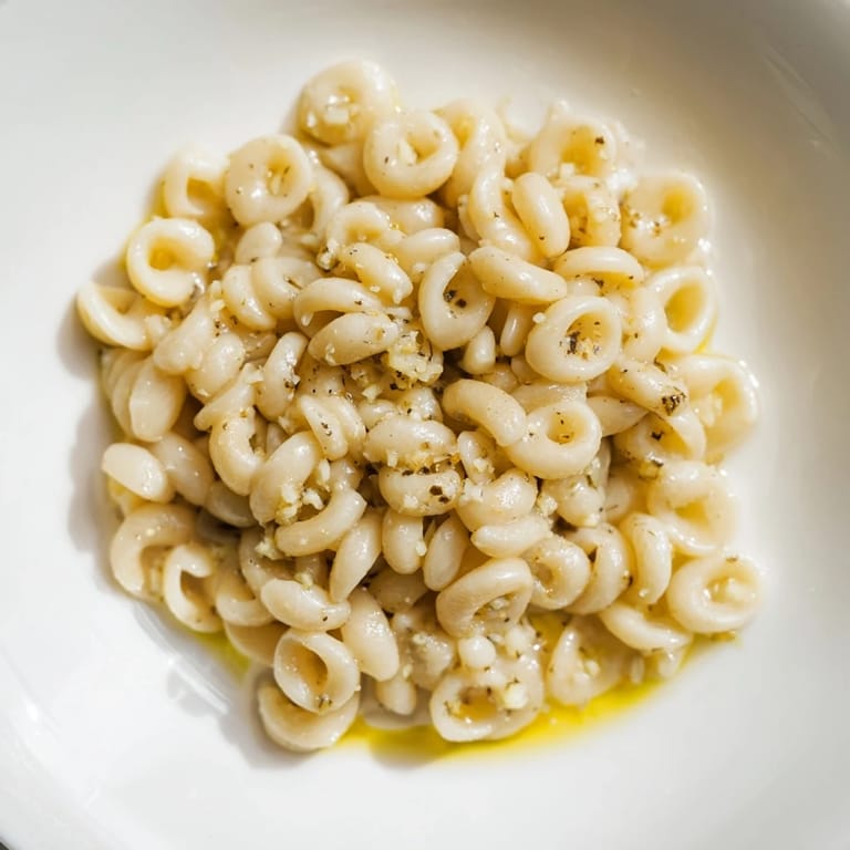 Tender ditalini pasta glistening with melted butter and garlic, a comforting 3-ingredient recipe.